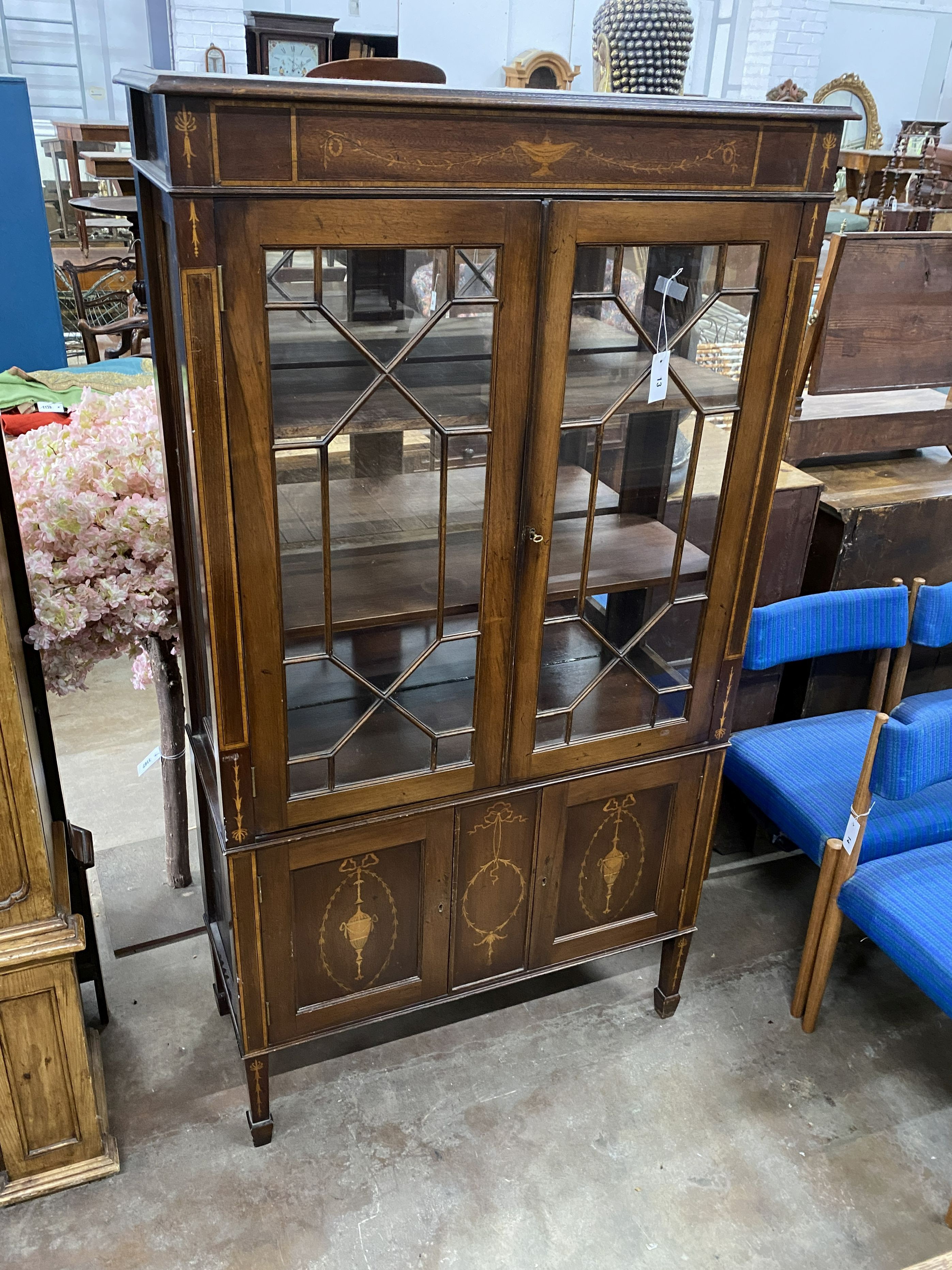 An Edwardian marquetry inlaid mahogany display cabinet, width 94cm, depth 38cm, height 174cm